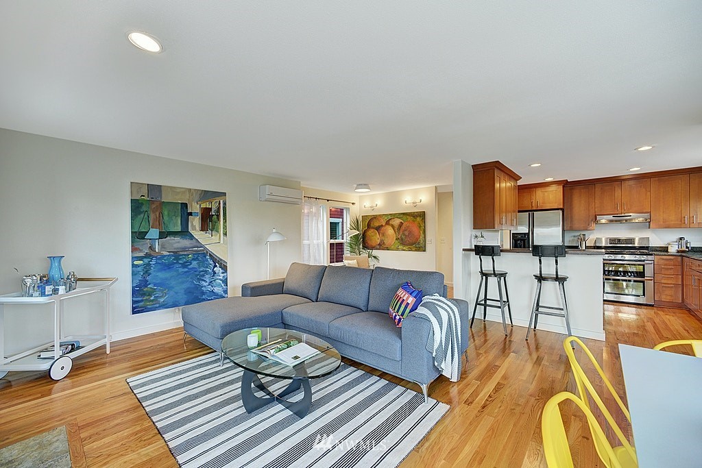 355 North 75th Street Seattle, WA 98103 - Photo 9 of 32 a living room with furniture and kitchen view