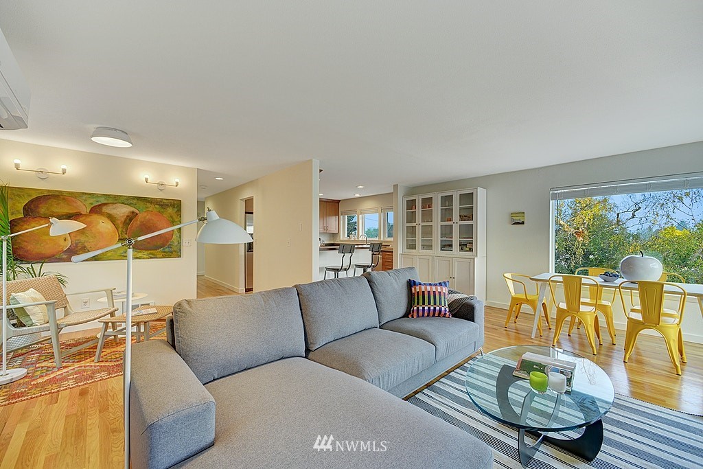 355 North 75th Street Seattle, WA 98103 - Photo 10 of 32 a living room with furniture and a large window