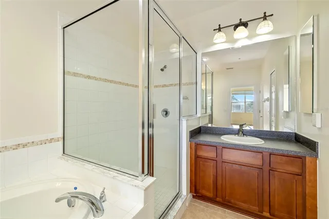 a bathroom with a granite countertop sink mirror and double