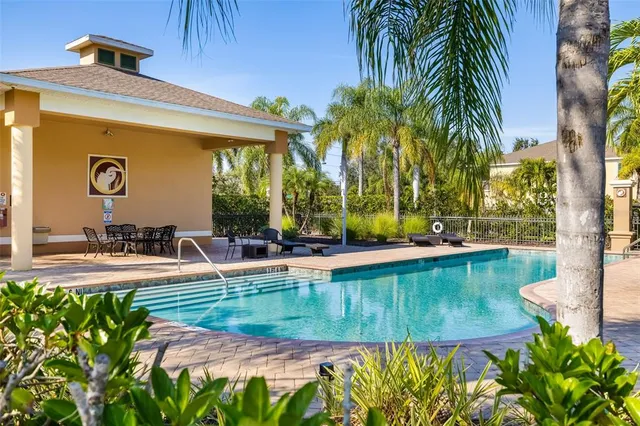 a view of a swimming pool with a patio
