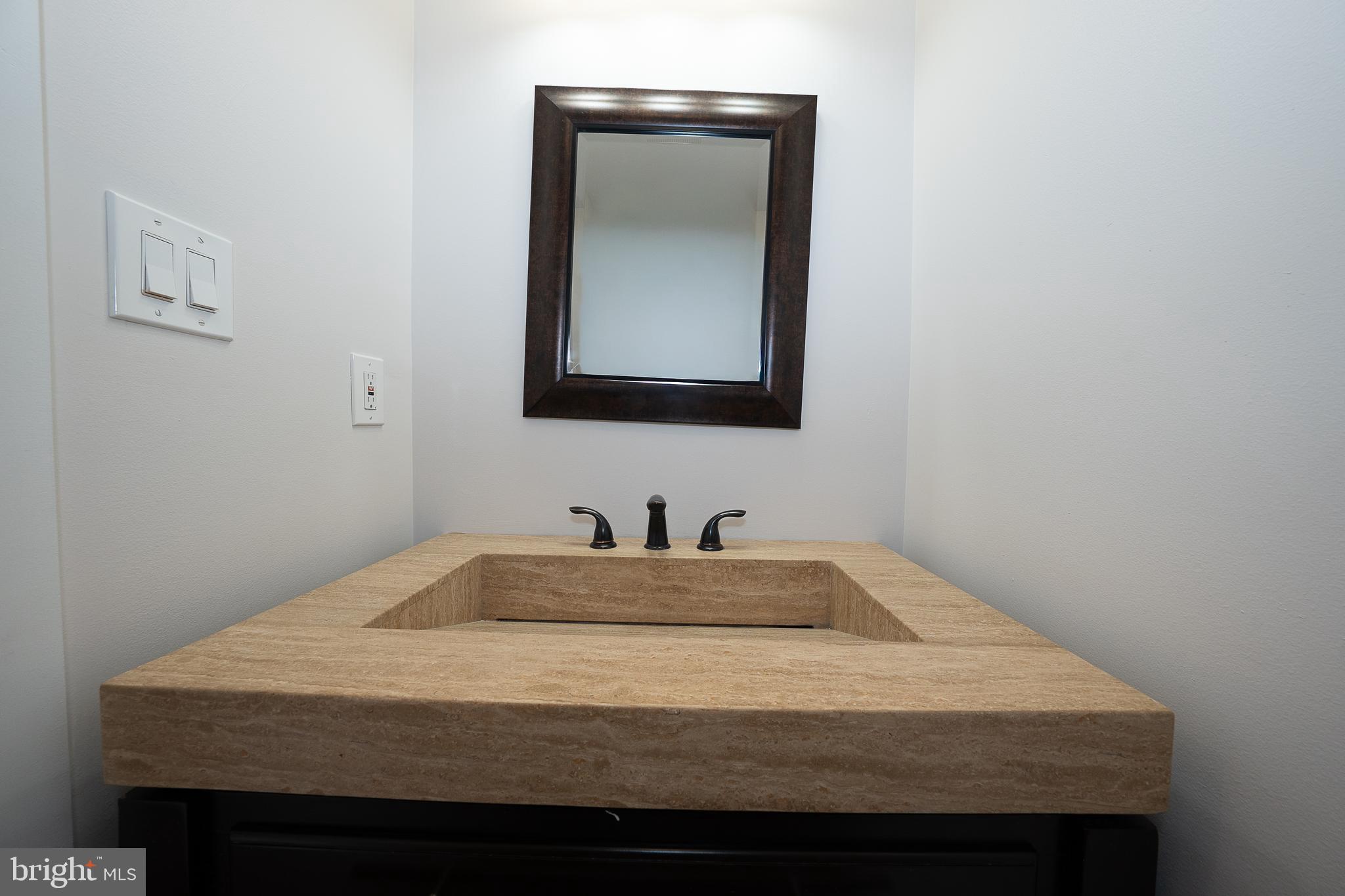 601 Poplar Street Philadelphia, PA 19123 - Photo 12 of 41 a bathroom with a sink vanity and mirror
