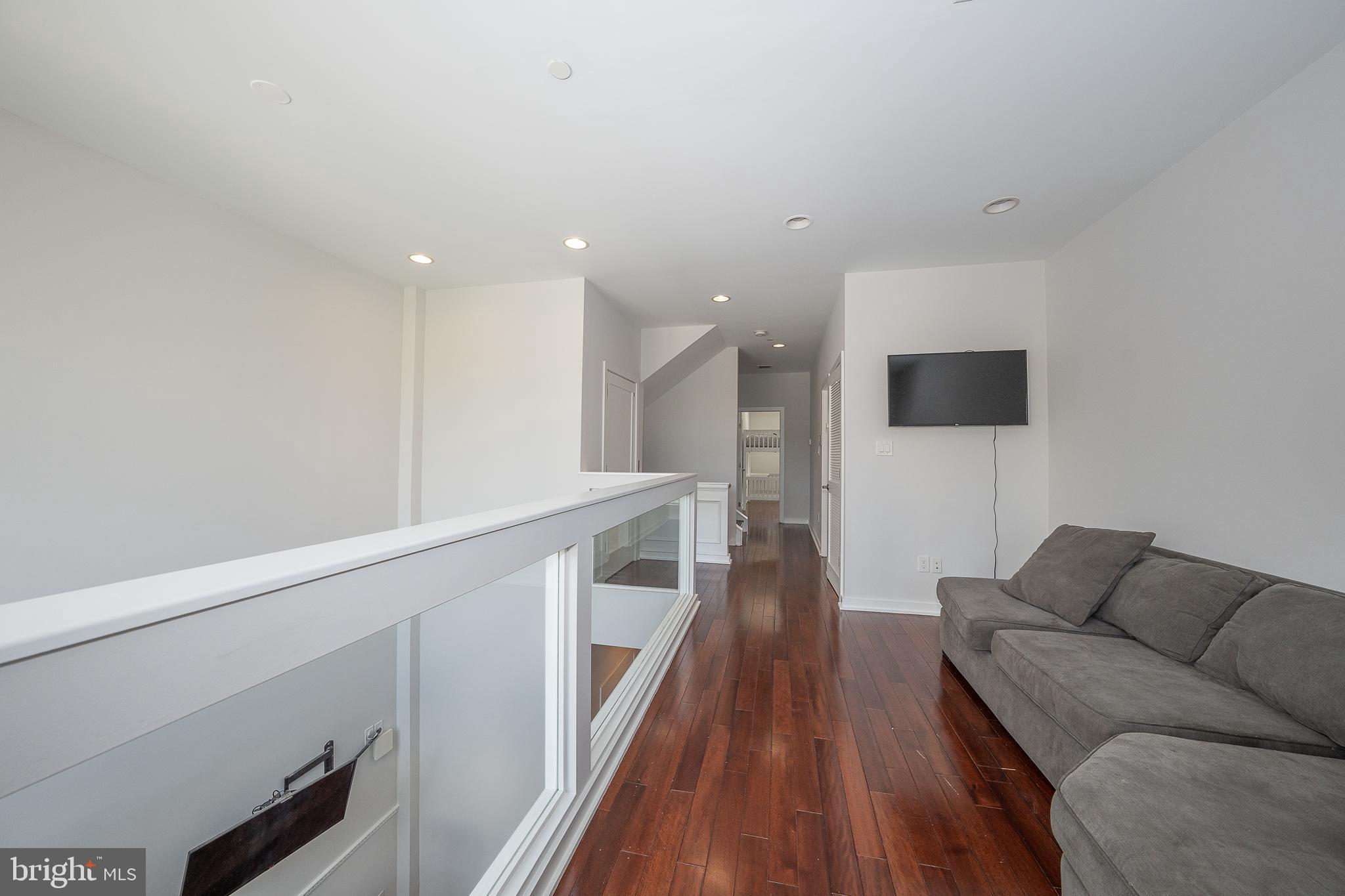 601 Poplar Street Philadelphia, PA 19123 - Photo 17 of 41 a living room with furniture and a wooden floor