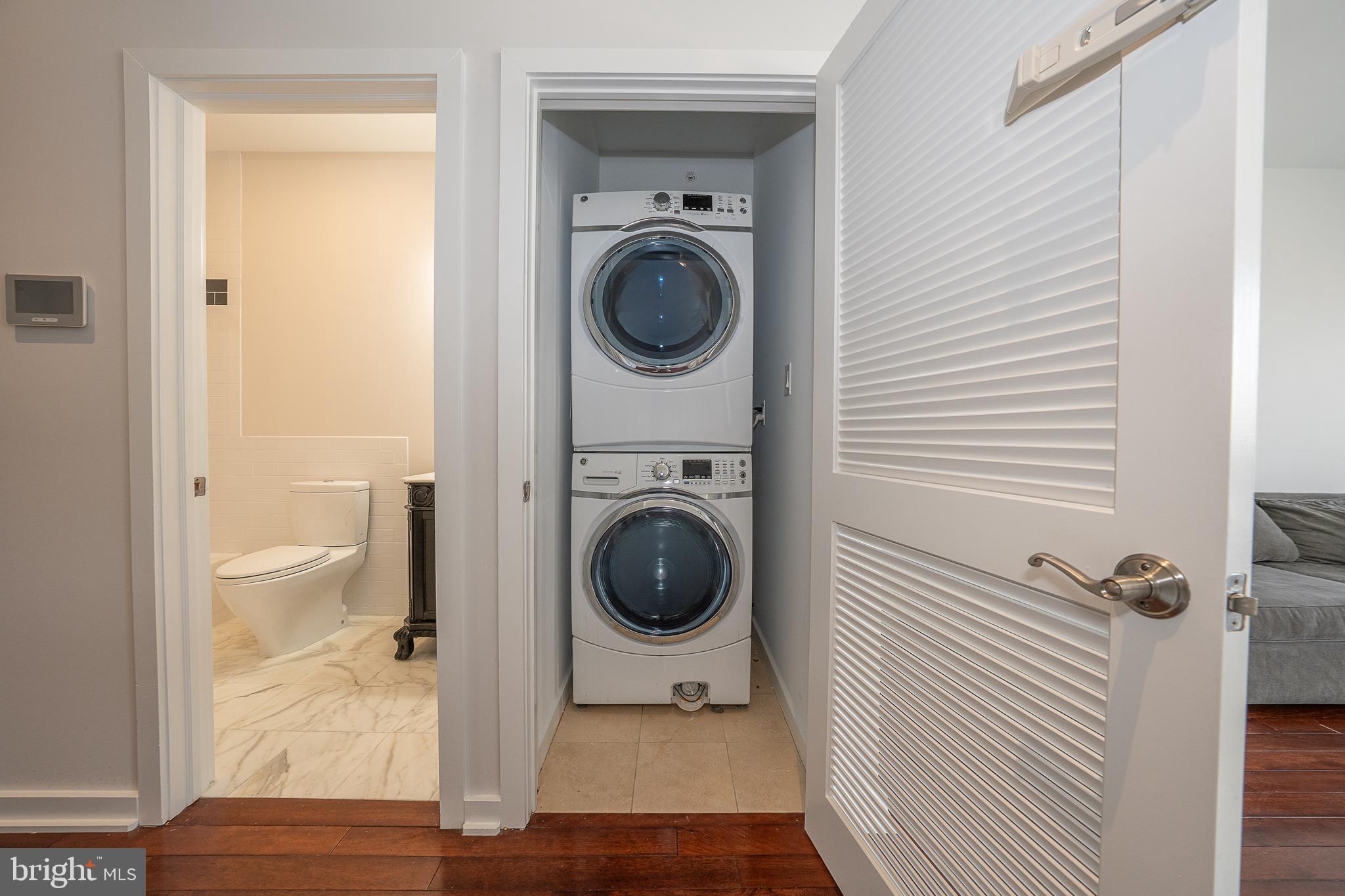 601 Poplar Street Philadelphia, PA 19123 - Photo 18 of 41 a view of a bathroom with washing machine and toilet