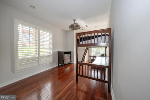 a view of an entryway with wooden floor