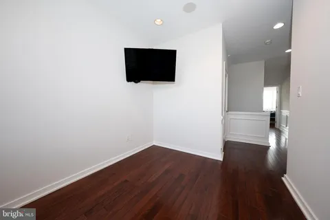 a view of a livingroom with wooden floor