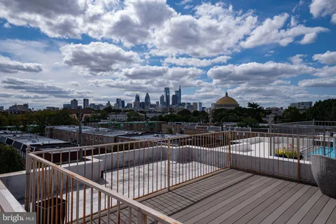 a view of a balcony with wooden floor