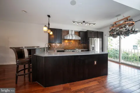 a view of kitchen and dining room with wooden floor
