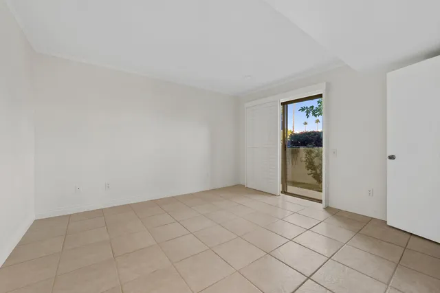 an empty room with entrance door