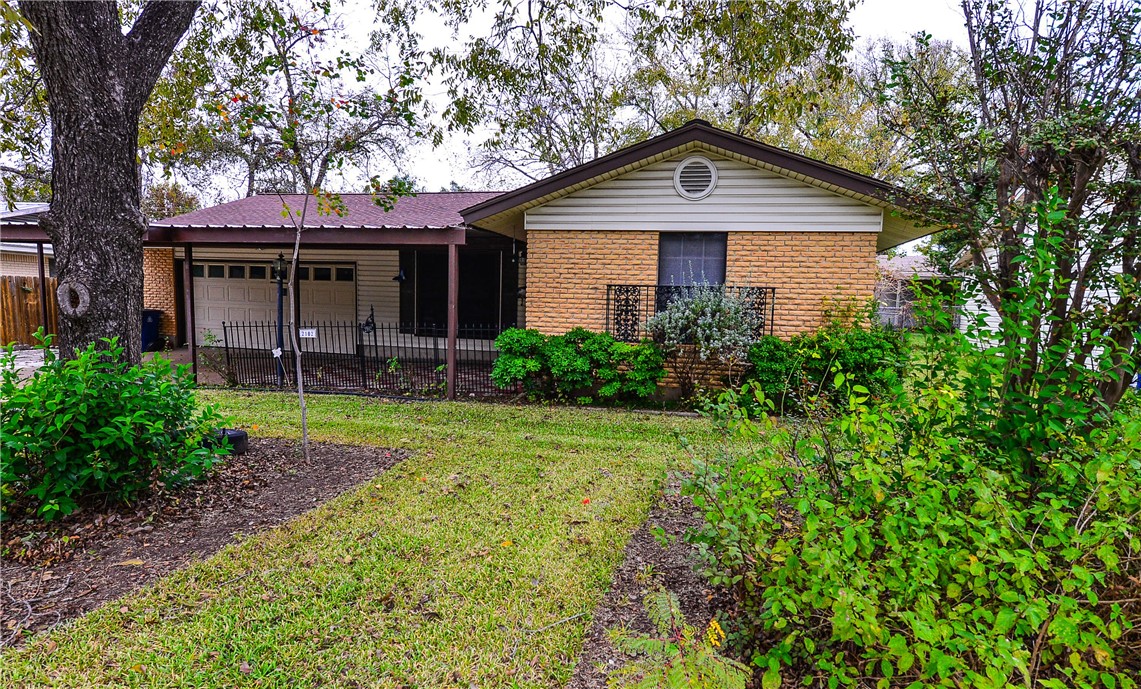 2102 Lanier Drive Austin, TX 78757 - Photo 1 of 1 a front view of a house with garden