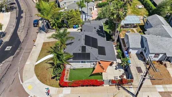 a picture of a house with a potted plant