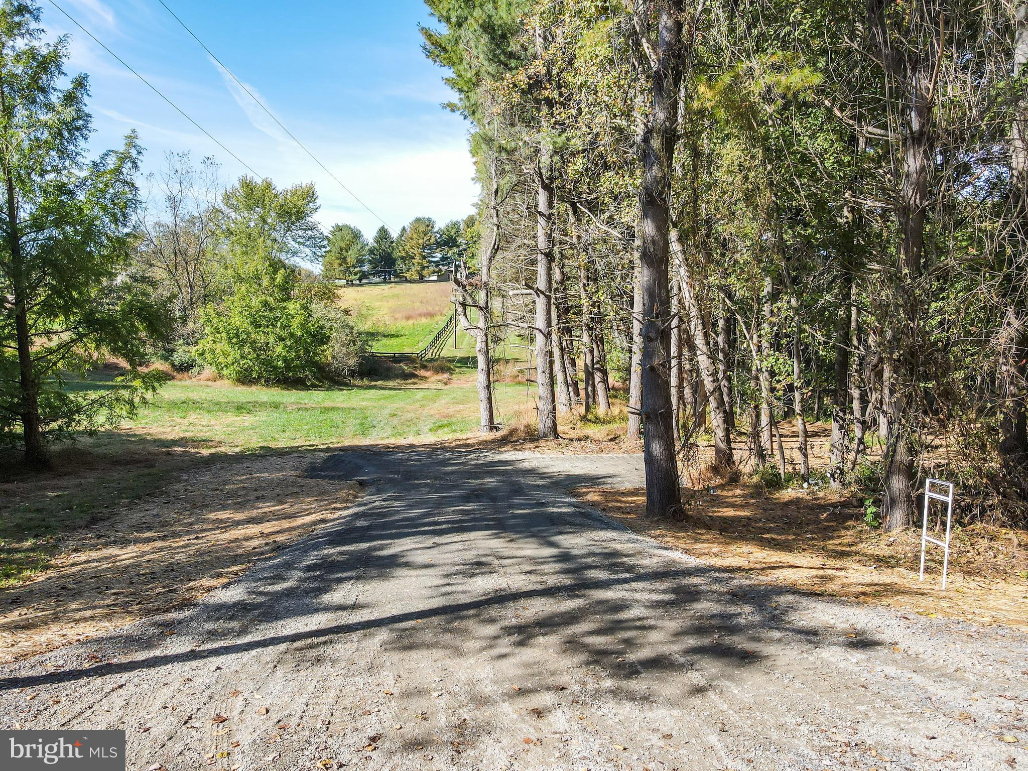 Greggsville Road, Unit 25A Purcellville, VA 20132 - Photo 2 of 8 a view of a yard with large trees