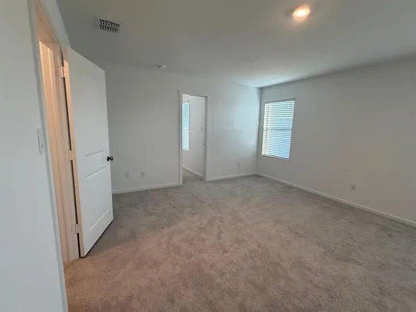a bathroom with a shower and toilet