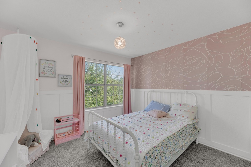 150 Mistletoe Lane Kyle, TX 78640 - Photo 20 of 35 a bedroom with a bed and a window