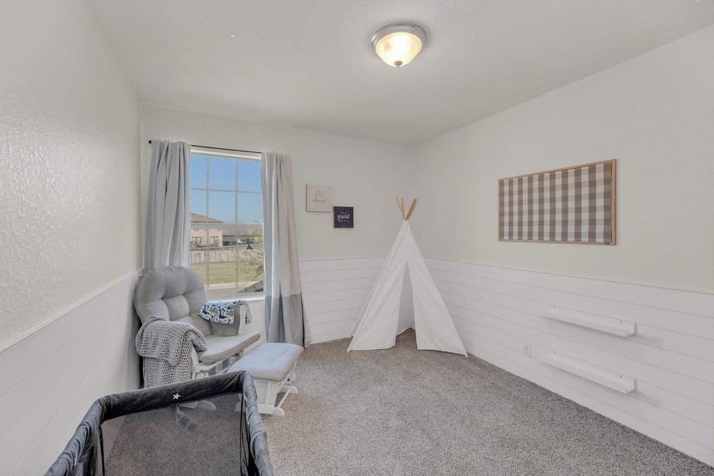 150 Mistletoe Lane Kyle, TX 78640 - Photo 24 of 35 a view of a livingroom with furniture and a window