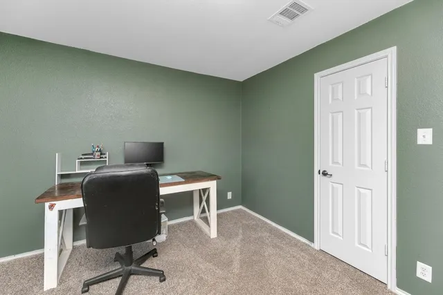 a view of a workspace with furniture