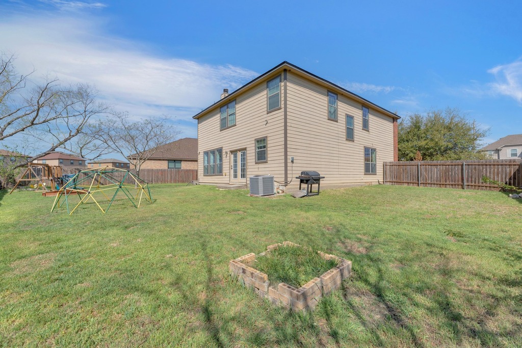 150 Mistletoe Lane Kyle, TX 78640 - Photo 28 of 35 a view of a house with a yard