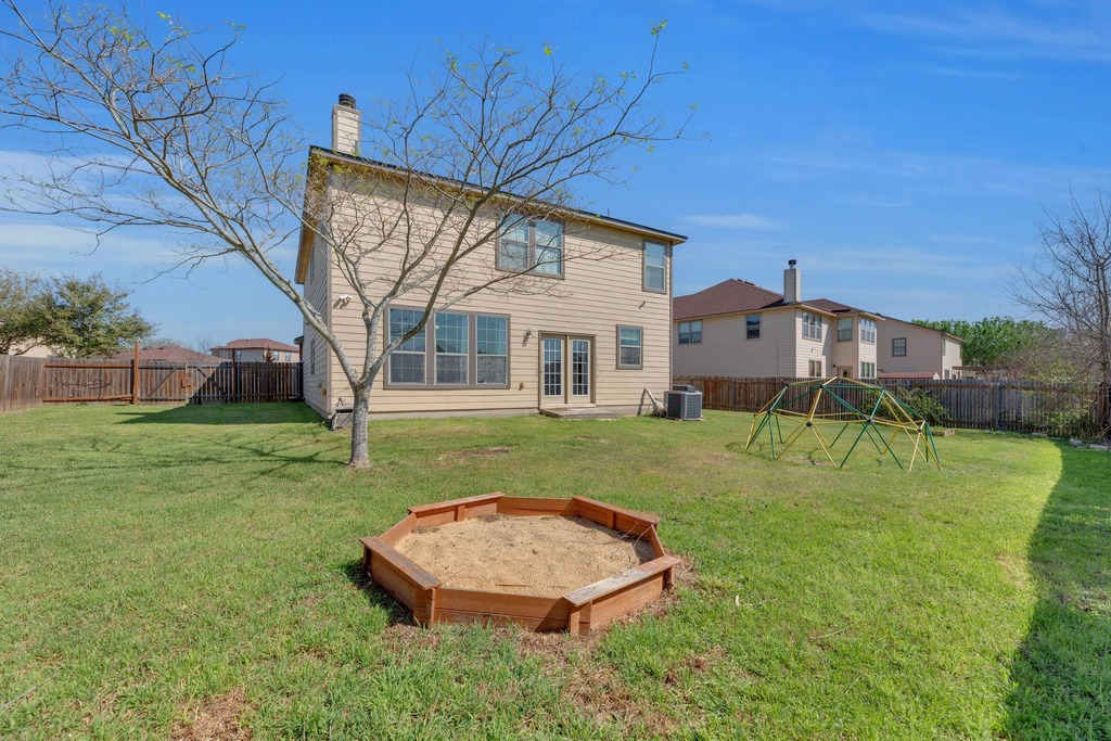 150 Mistletoe Lane Kyle, TX 78640 - Photo 30 of 35 front view of a house with a yard