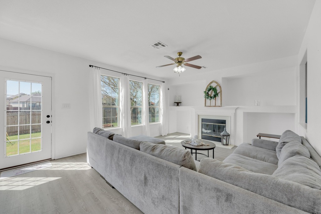 150 Mistletoe Lane Kyle, TX 78640 - Photo 5 of 35 a living room with furniture and a fireplace