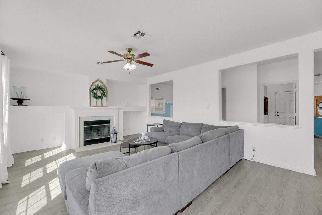 150 Mistletoe Lane Kyle, TX 78640 - Photo 6 of 35 a living room with furniture and a fireplace