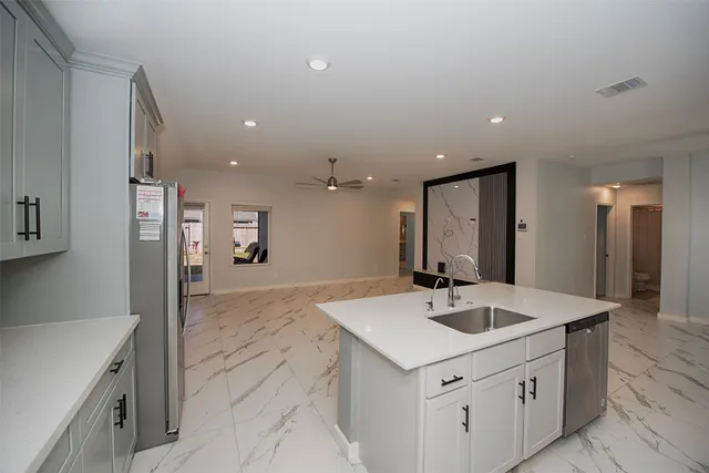 a bathroom with a sink a mirror and a shower