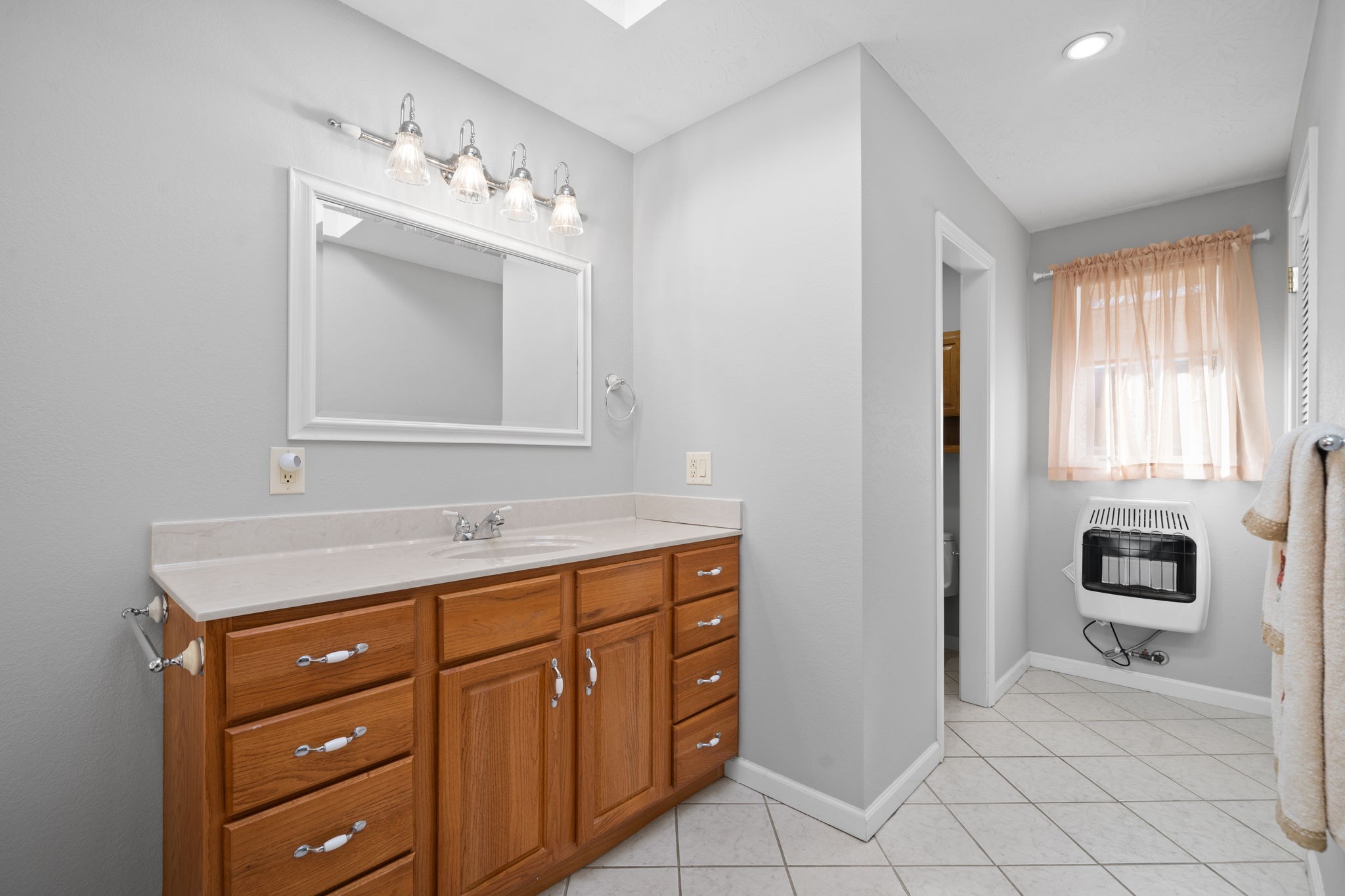 3426 Buck Road Clarksville, TN 37043 - Photo 32 of 57 a bathroom with a toilet sink and mirror