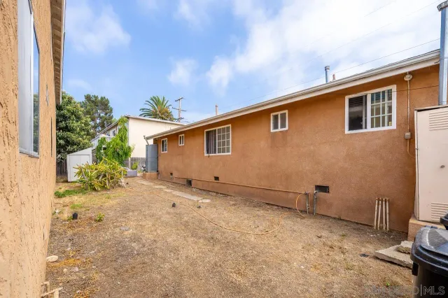 a view of a balcony with flower plants