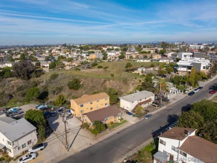 an aerial view of a city with lots of residential buildings