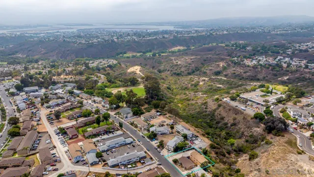 an aerial view of residential houses with outdoor space