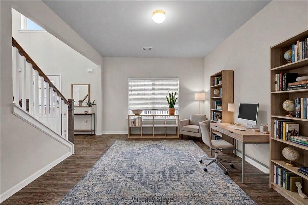 616 Hydrangea Lane Bremen, GA 30110 - Photo 15 of 49 a living room with furniture and a book shelf