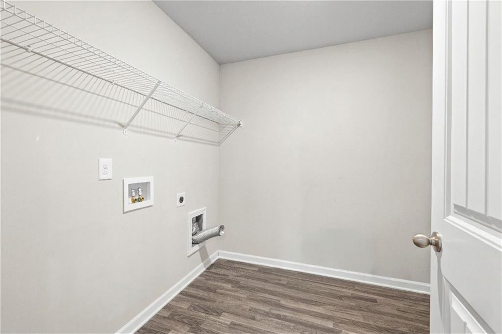 616 Hydrangea Lane Bremen, GA 30110 - Photo 22 of 49 a view of a room with wooden floor and white walls