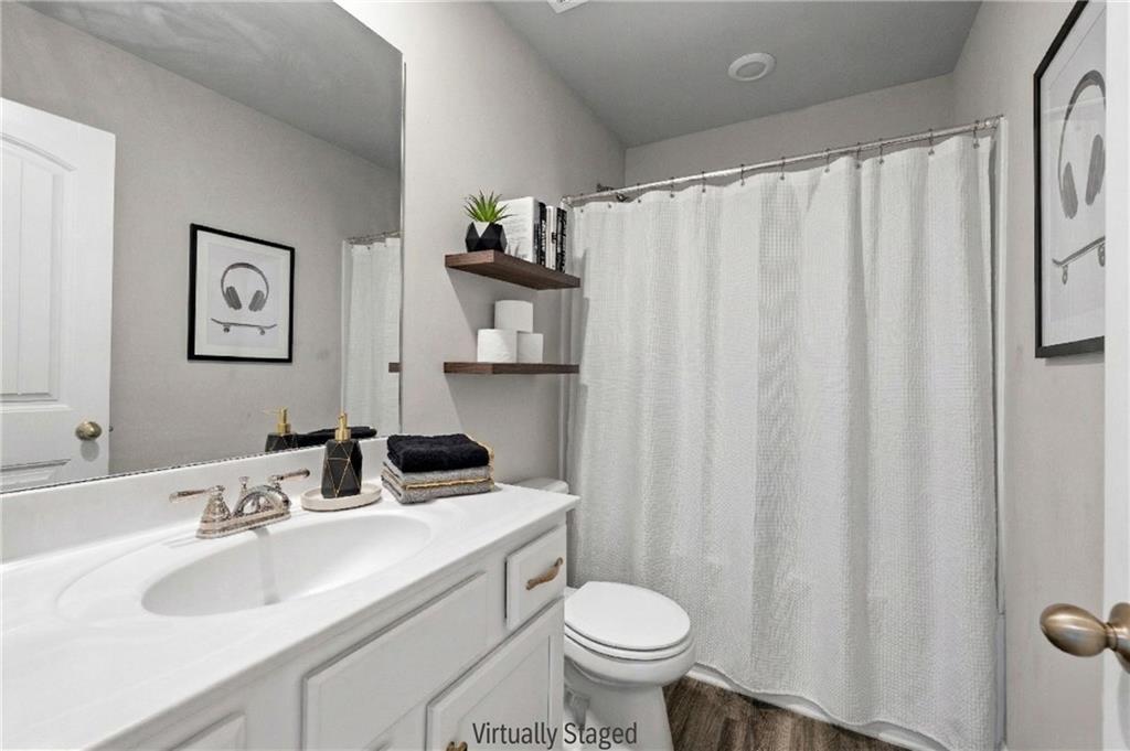 616 Hydrangea Lane Bremen, GA 30110 - Photo 23 of 49 a bathroom with a sink toilet and shower