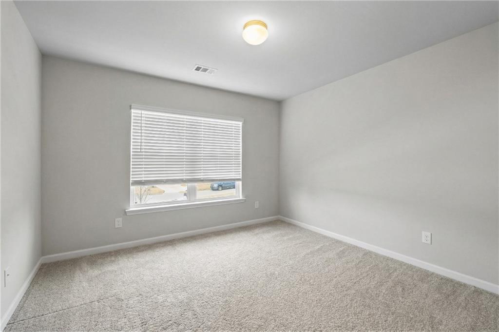 616 Hydrangea Lane Bremen, GA 30110 - Photo 26 of 49 an empty room with a window