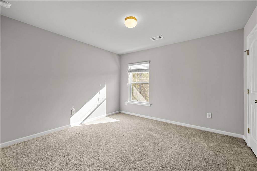 616 Hydrangea Lane Bremen, GA 30110 - Photo 30 of 49 a view of an empty room with a window