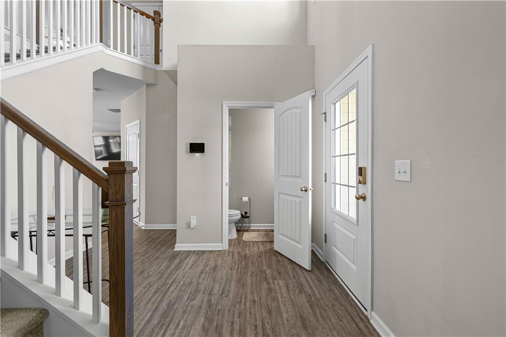 616 Hydrangea Lane Bremen, GA 30110 - Photo 37 of 49 a view of a hallway with wooden floor and staircase