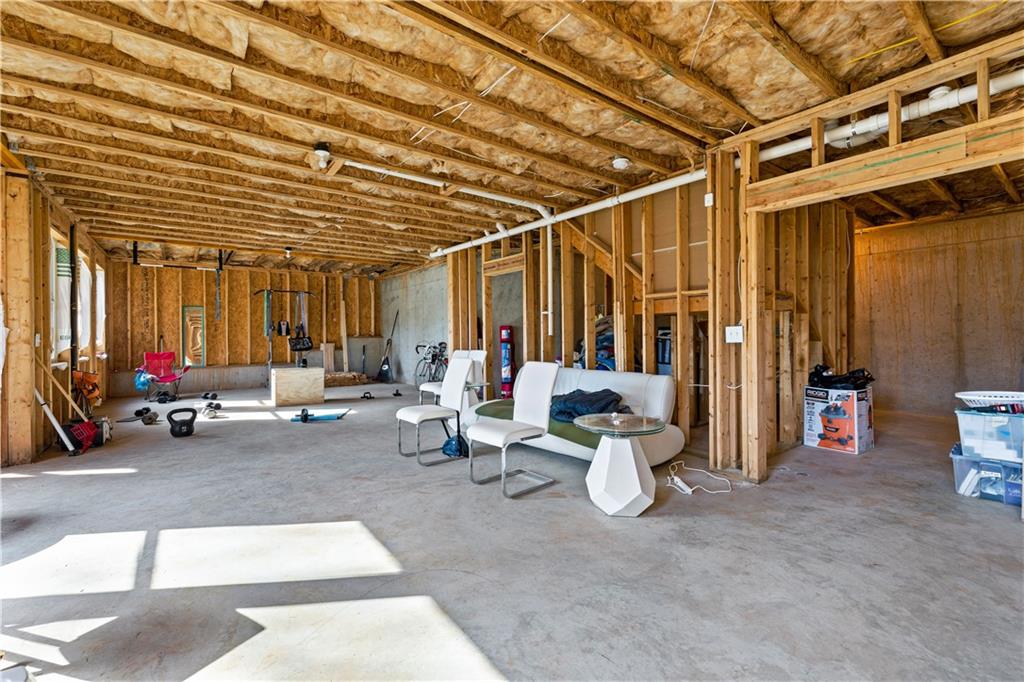 616 Hydrangea Lane Bremen, GA 30110 - Photo 40 of 49 a view of a patio with dining table and chairs