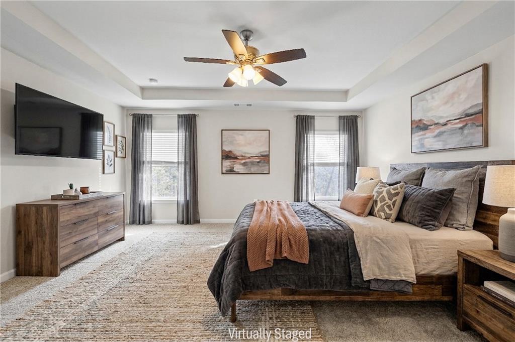 616 Hydrangea Lane Bremen, GA 30110 - Photo 7 of 49 a spacious bedroom with a bed and a flat screen tv