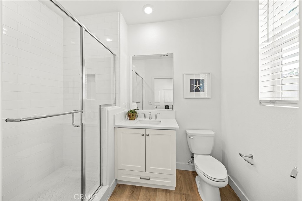 1533 St Simon Circle, Unit B Alhambra, CA 91803 - Photo 15 of 27 a bathroom with a toilet a sink and a window