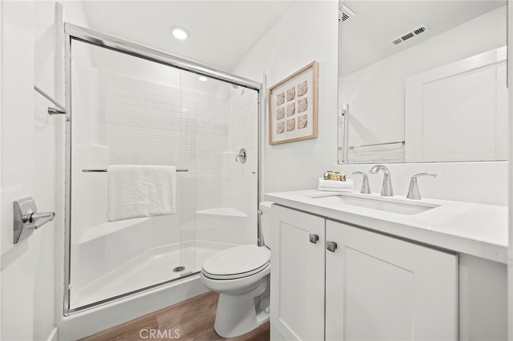 1533 St Simon Circle, Unit B Alhambra, CA 91803 - Photo 17 of 27 a bathroom with a shower sink vanity mirror and toilet