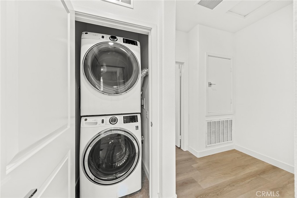 1533 St Simon Circle, Unit B Alhambra, CA 91803 - Photo 18 of 27 a view of a hallway with washer and dryer
