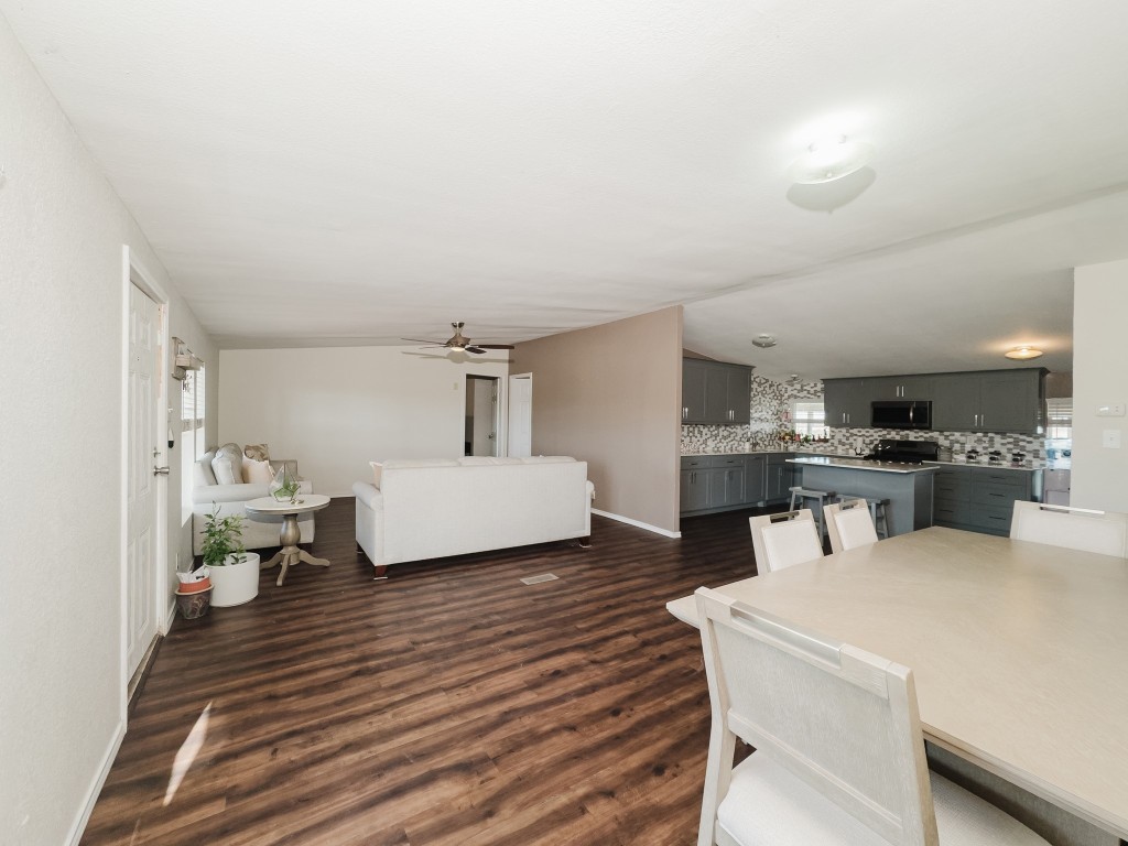 2709 County Road 463 Elgin, TX 78621 - Photo 10 of 40 Dining room with dark wood finished floors and ceiling fan