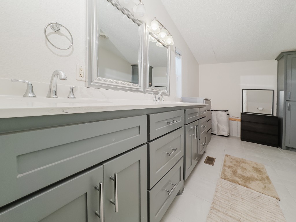 2709 County Road 463 Elgin, TX 78621 - Photo 23 of 40 Full bath with double vanity and light tile patterned floors