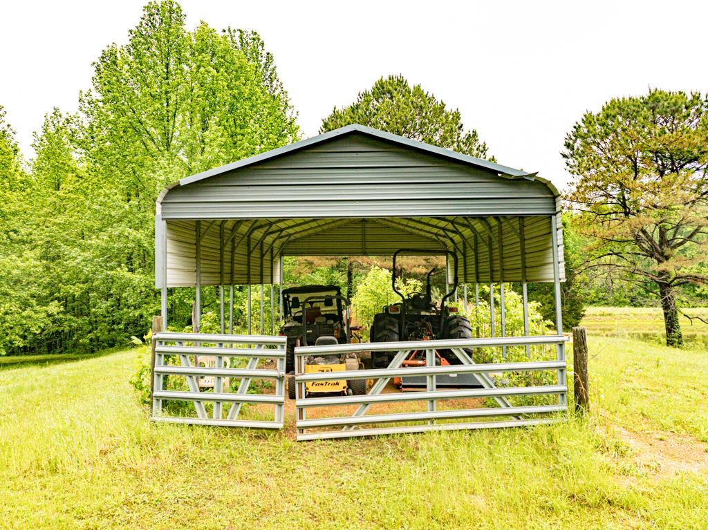 0 Poplar Grove Cemetery Road Henning, TN 38041 - Photo 29 of 40 Freestanding metal carport structure featuring a curved roof and open sides