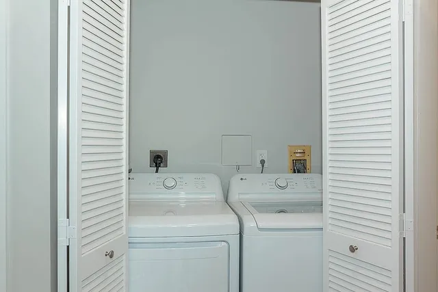 a utility room with dryer and washer