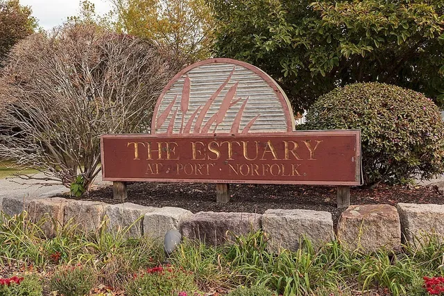 a view of outdoor space with signage and flags
