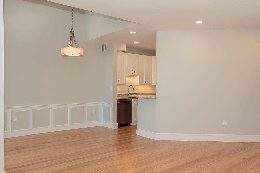 171 Walnut Street, Unit 4 Boston, MA 02122 - Photo 10 of 31 a view of a kitchen with a sink and wooden floor