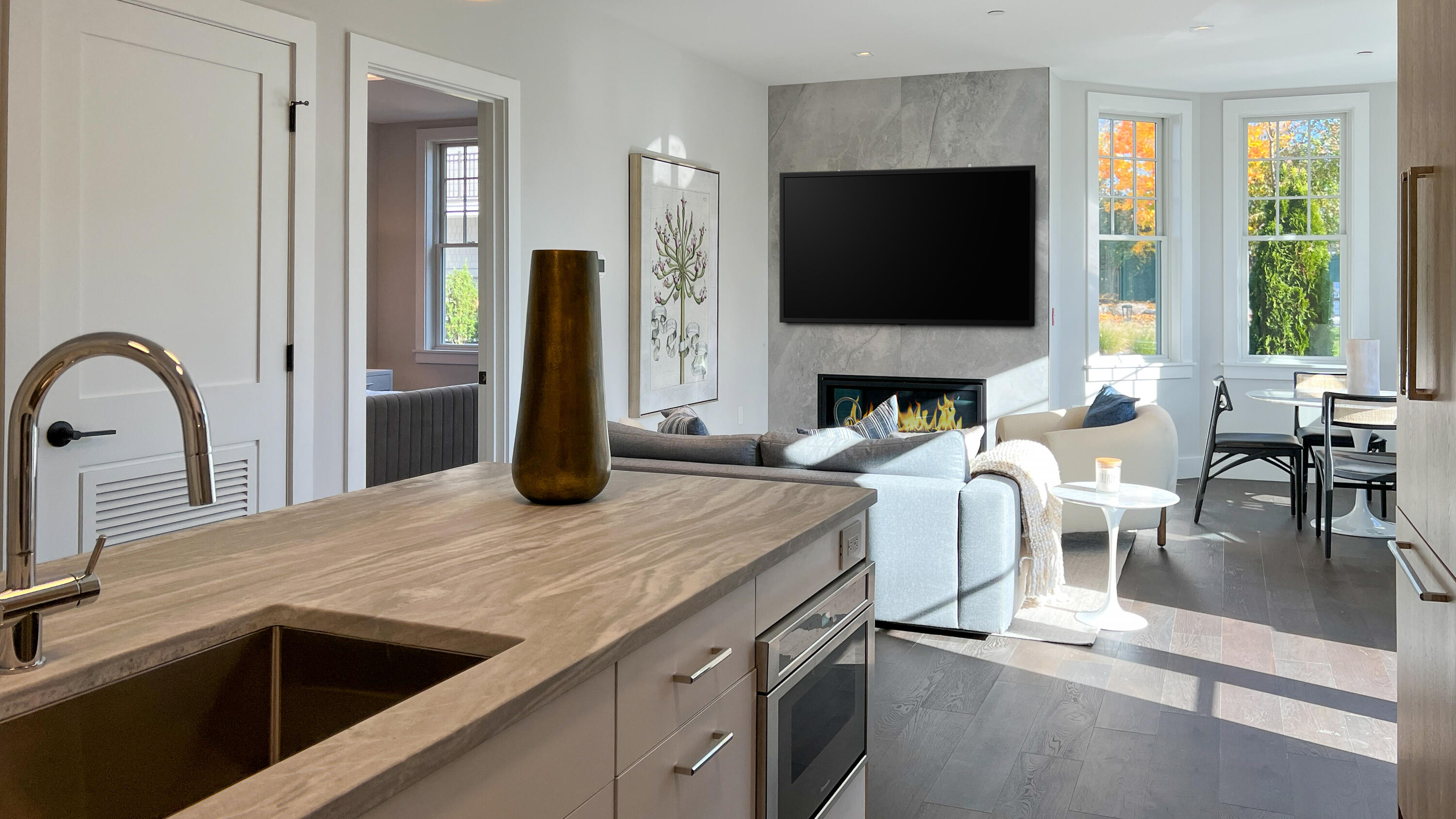 180 Park Street, Unit 204 New Canaan, CT 06840 - Photo 12 of 31 a kitchen with a table chairs and a flat screen tv