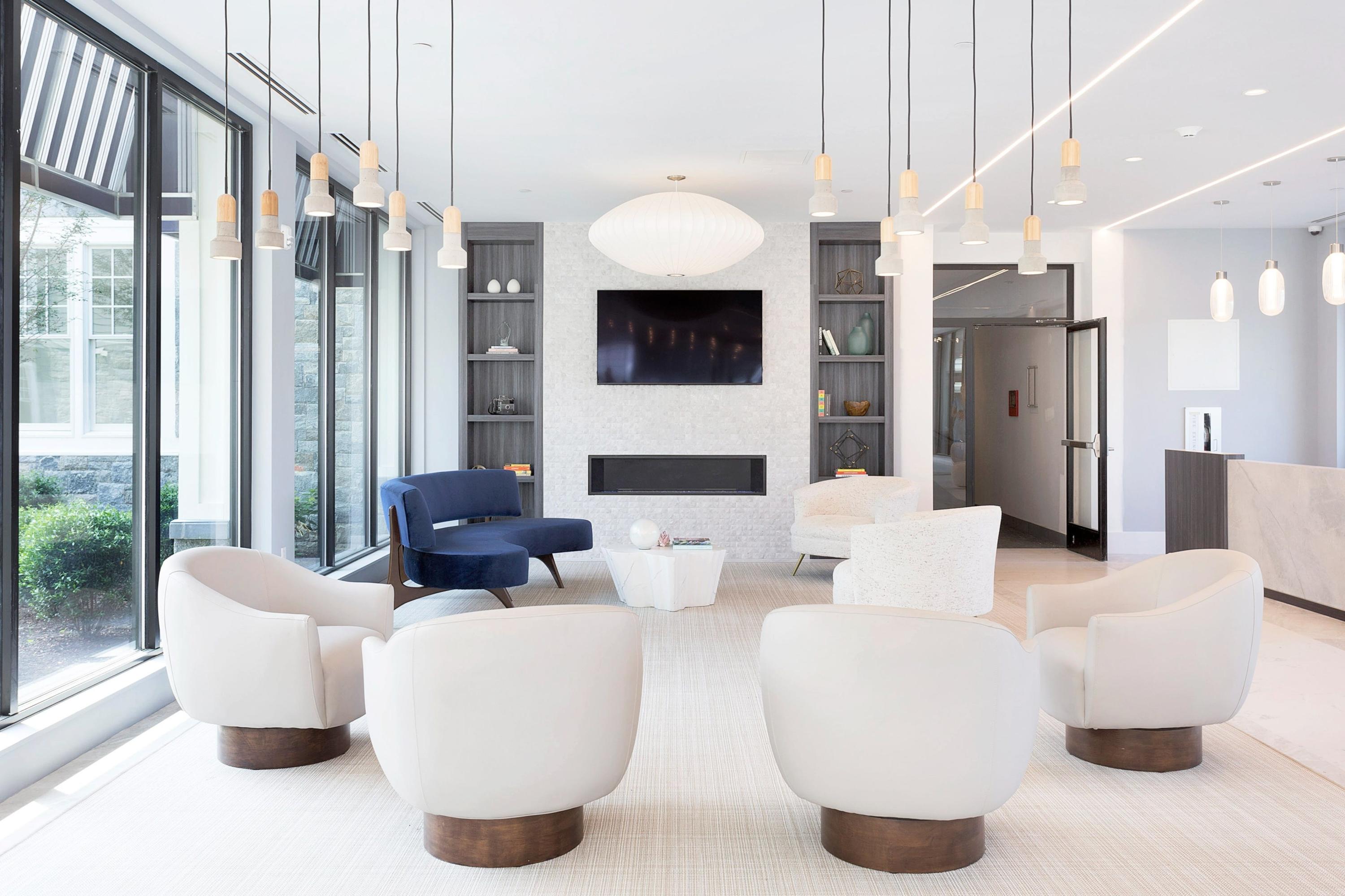 180 Park Street, Unit 204 New Canaan, CT 06840 - Photo 3 of 31 a living room with fireplace furniture and a large window