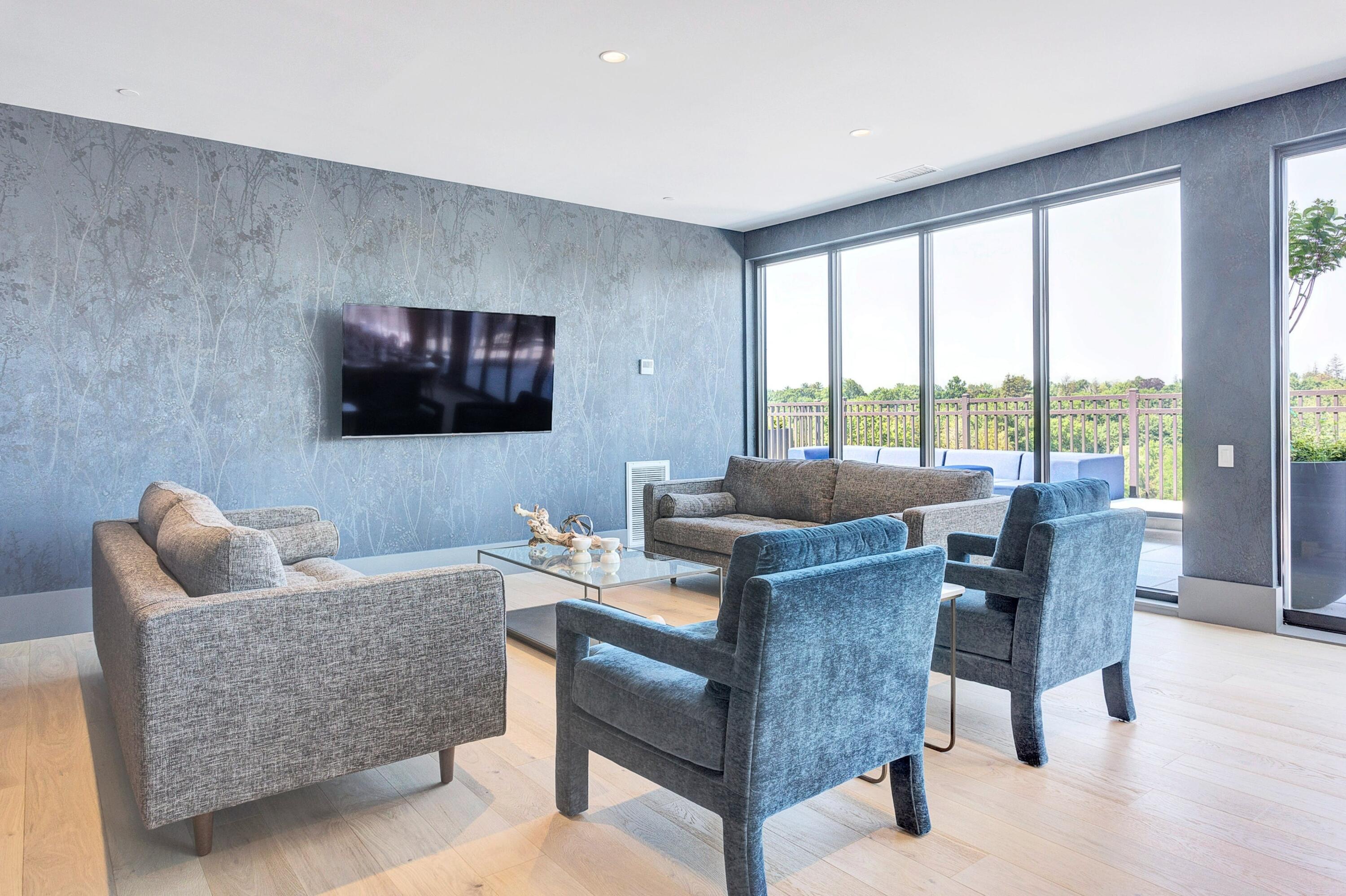 180 Park Street, Unit 204 New Canaan, CT 06840 - Photo 22 of 31 a living room with furniture and a flat screen tv