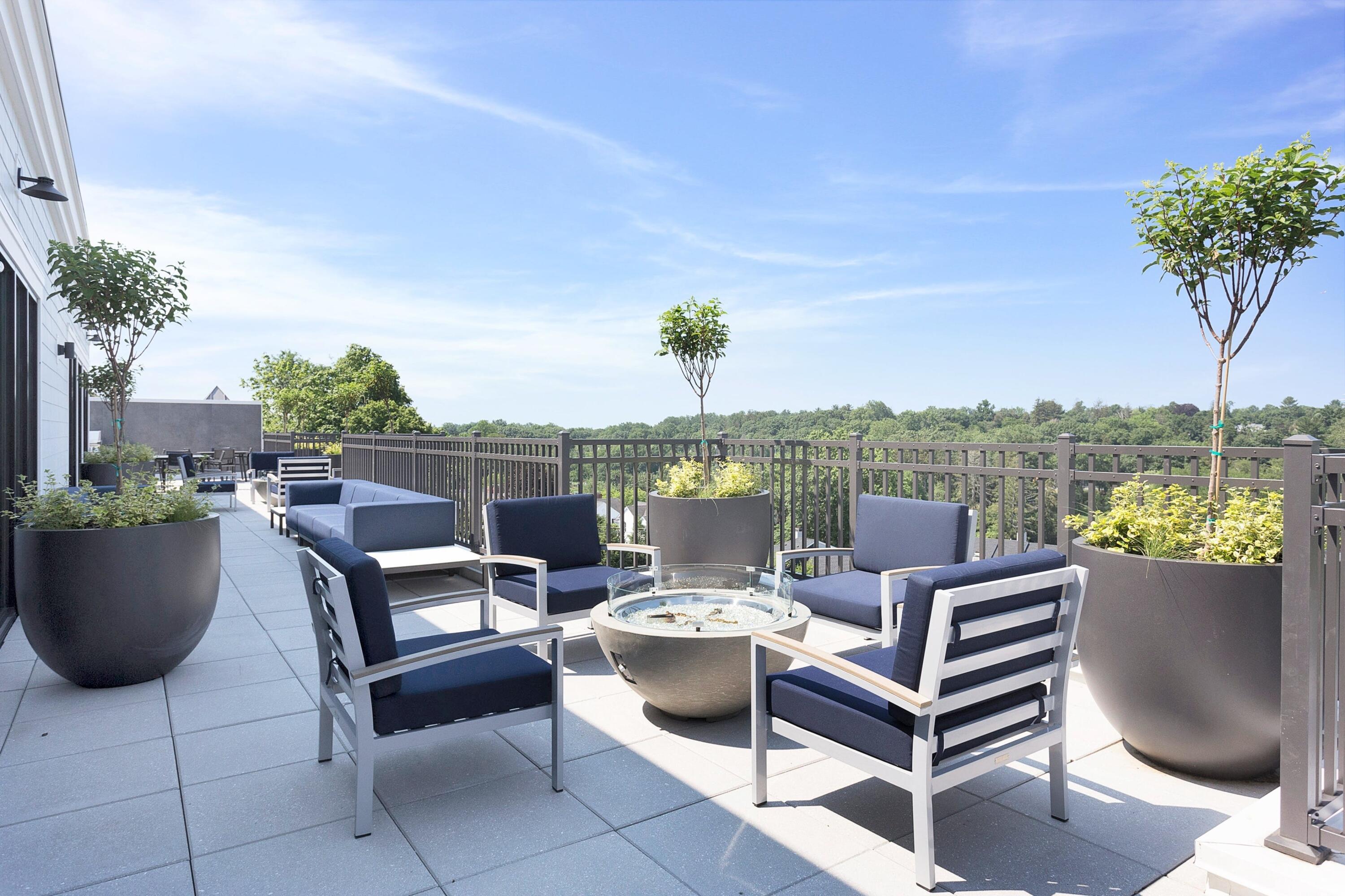 180 Park Street, Unit 204 New Canaan, CT 06840 - Photo 26 of 31 a view of a terrace with furniture