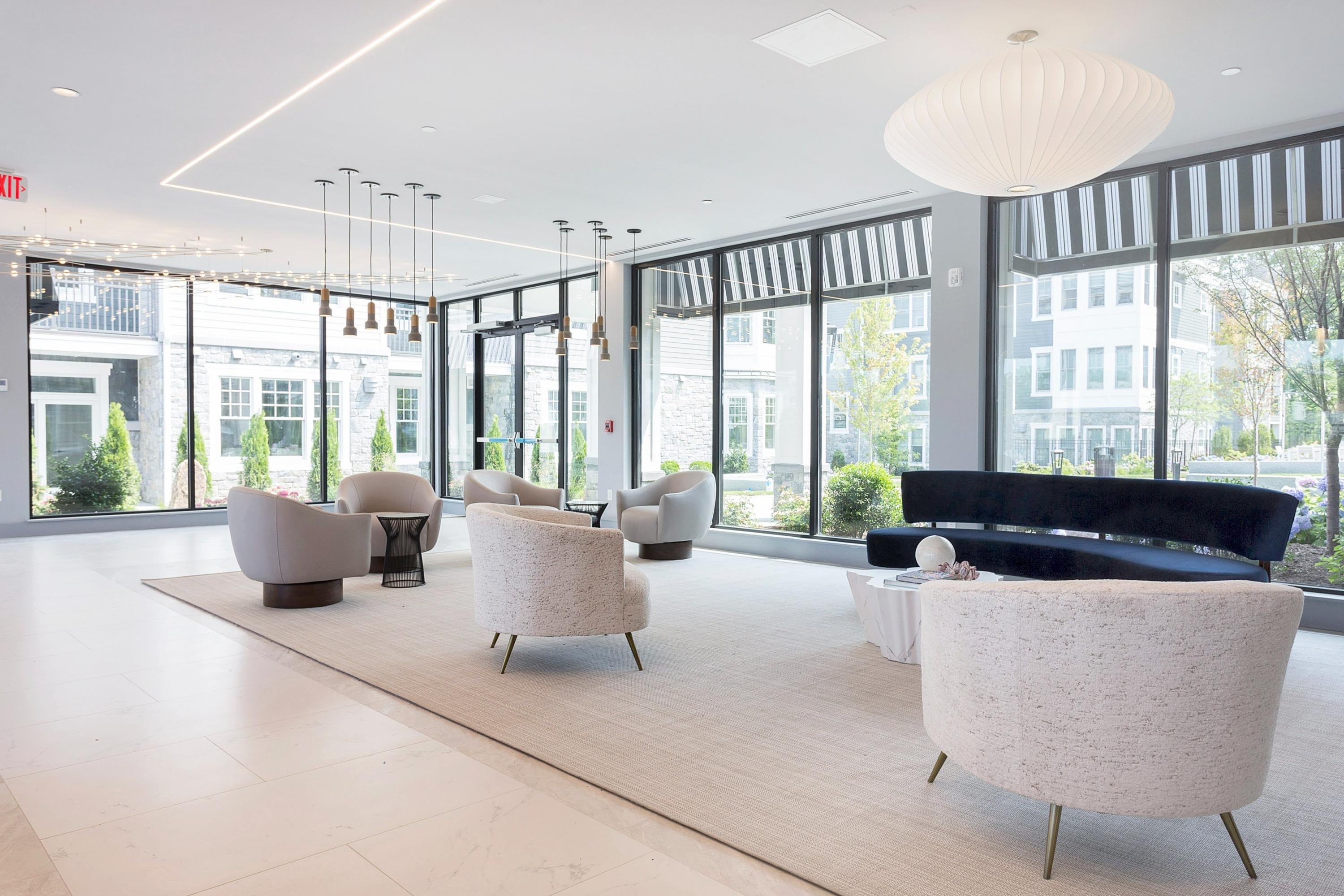 180 Park Street, Unit 204 New Canaan, CT 06840 - Photo 5 of 31 a living room with furniture and a large window